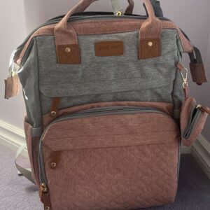 Diaper bag with detachable changing pad